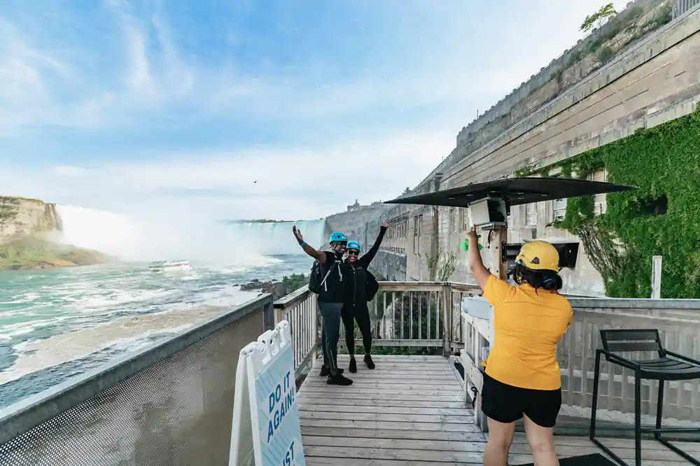 Riders on the deck at the top with the falls beyond