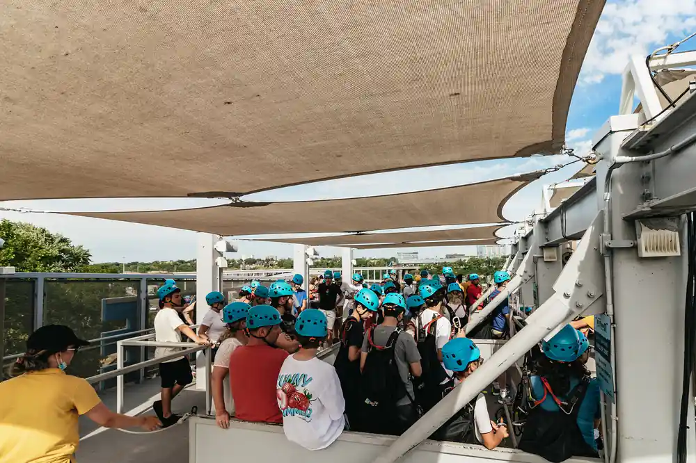 Riders queuing under the shade at the launch